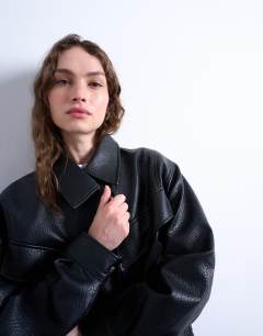 Model wearing Faux leather bubble boxy zip through bomber jacket in black
