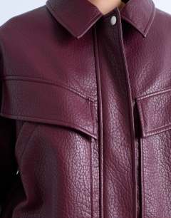 Model wearing Faux leather bubble boxy zip through bomber jacket in burgundy
