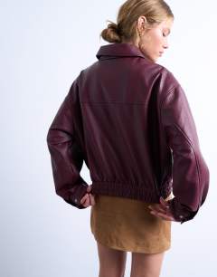Model wearing Faux leather bubble boxy zip through bomber jacket in burgundy