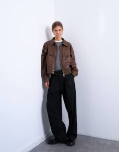 Model wearing Faux leather bubble boxy zip through pocket bomber jacket in washed brown