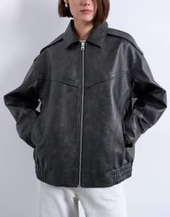 Model wearing Faux leather bubble vintage wash seam detail zip thru bomber jacket in washed black