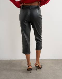 Model wearing Faux leather capri trouser with side splits in black