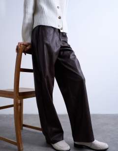 Model wearing Faux leather cinch trouser in brown