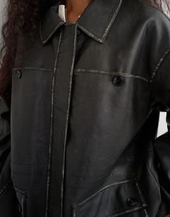 Model wearing Faux leather cinch waist jacket in black