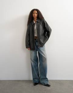 Model wearing Faux leather cinch waist jacket in black