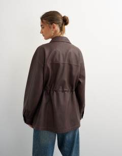 Model wearing Faux leather cinched jacket in washed brown