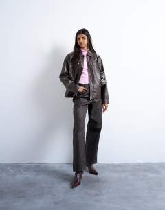 Model wearing Faux leather clean zip through jacket in deep burgundy