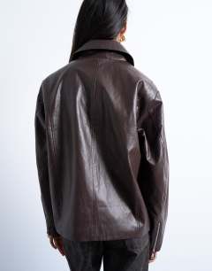 Model wearing Faux leather clean zip through jacket in deep burgundy