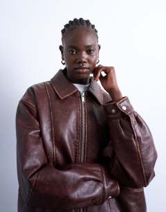 Model wearing Faux leather contrast heavy wash bomber jacket in brown