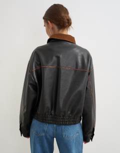 Model wearing Faux leather contrast rib collar bomber jacket in black