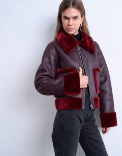 Faux leather cropped jacket with red borg contrast