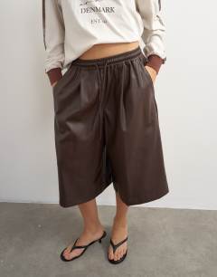 Model wearing Faux leather culotte in brown
