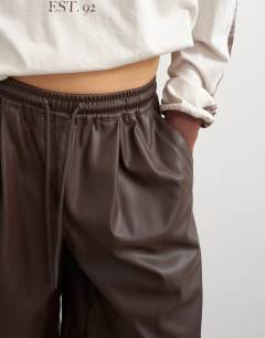 Model wearing Faux leather culotte in brown