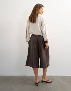 Model wearing Faux leather culotte in brown