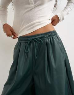 Model wearing Faux leather culotte in green
