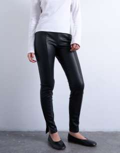 Model wearing Faux leather drain pipe skinny trouser in black