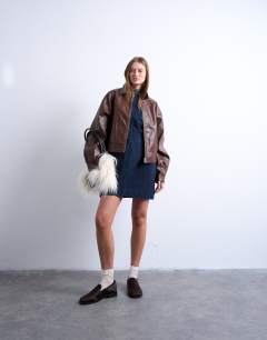 Model wearing Faux leather drop shoulder cropped zip thru jacket in chocolate