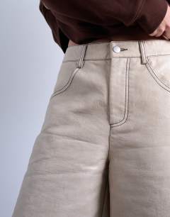 Model wearing Faux leather editor longline short in cream