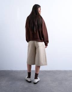 Model wearing Faux leather editor longline short in cream