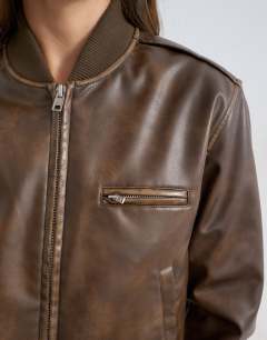 Model wearing Faux leather fitted bomber jacket in washed brown