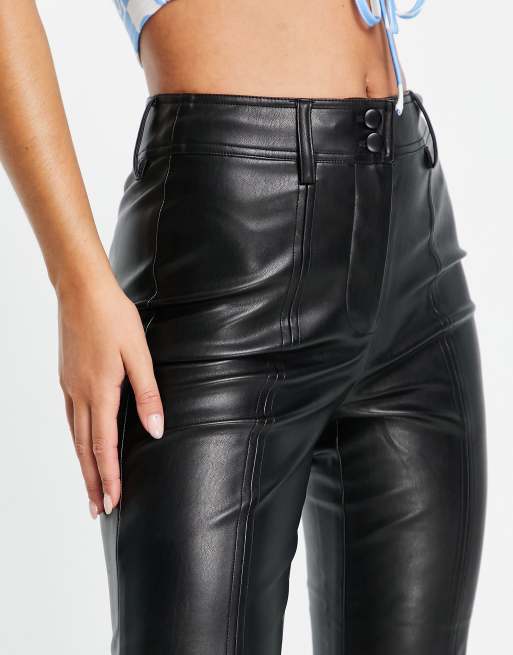 Topshop Petite faux leather flared trousers in black, ASOS