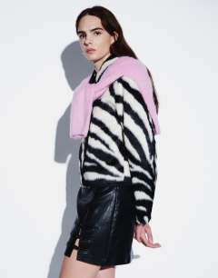 Model wearing Faux leather frogging detail mini skirt in black