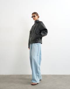 Model wearing Faux leather funnel button through jacket in black