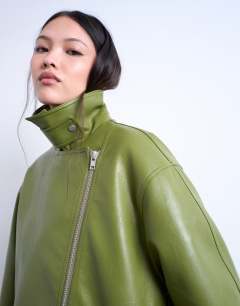 Model wearing Faux leather funnel neck biker jacket in green