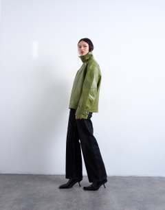 Model wearing Faux leather funnel neck biker jacket in green