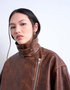 Model wearing Faux leather funnel neck biker jacket in washed brown