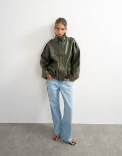Model wearing Faux leather funnel neck drawstring bomber in green