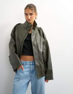 Model wearing Faux leather funnel neck drawstring bomber in green