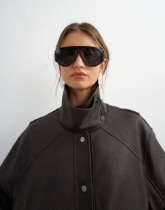 Model wearing Faux leather funnel neck jacket in chocolate