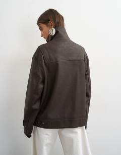 Model wearing Faux leather funnel neck jacket in chocolate