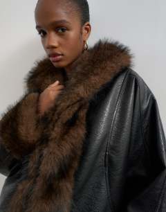 Model wearing Faux leather fur trim jacket in black