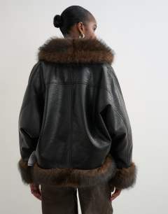 Model wearing Faux leather fur trim jacket in black