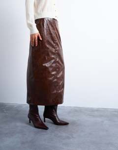 Model wearing Faux leather high shine midi skirt in brown