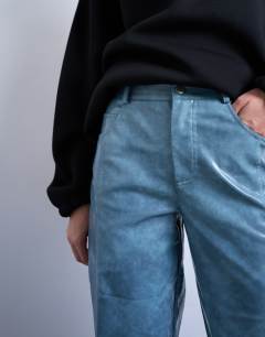 Model wearing Faux leather high shine scoop pocket wide leg trouser in navy