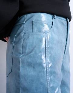 Model wearing Faux leather high shine scoop pocket wide leg trouser in navy