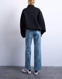 Model wearing Faux leather high shine scoop pocket wide leg trouser in navy