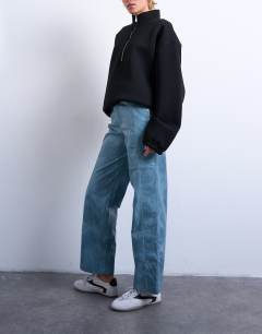 Model wearing Faux leather high shine scoop pocket wide leg trouser in navy