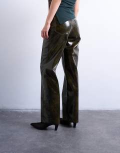 Model wearing Faux leather high shine scoop pocket wide leg trouser in washed green