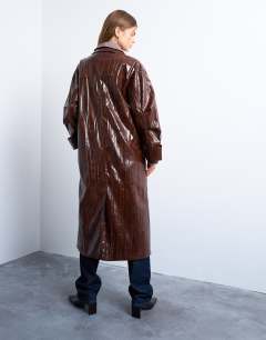Model wearing Faux leather high shine washed trench coat in washed brown