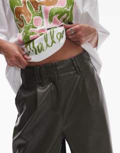 Model wearing Faux leather high waist pleated straight leg trouser  in khaki