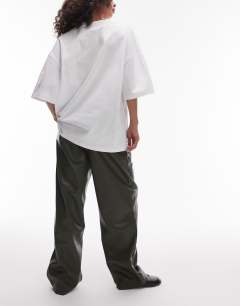 Model wearing Faux leather high waist pleated straight leg trouser  in khaki