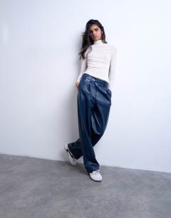 Model wearing Faux leather high waist pleated straight leg trouser in navy