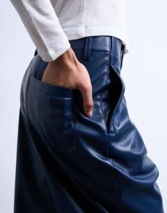 Model wearing Faux leather high waist pleated straight leg trouser in navy