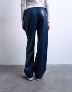 Model wearing Faux leather high waist pleated straight leg trouser in navy