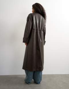 Model wearing Faux leather longline cinch waist trench coat in brown