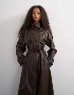 Model wearing Faux leather longline cinch waist trench coat in brown